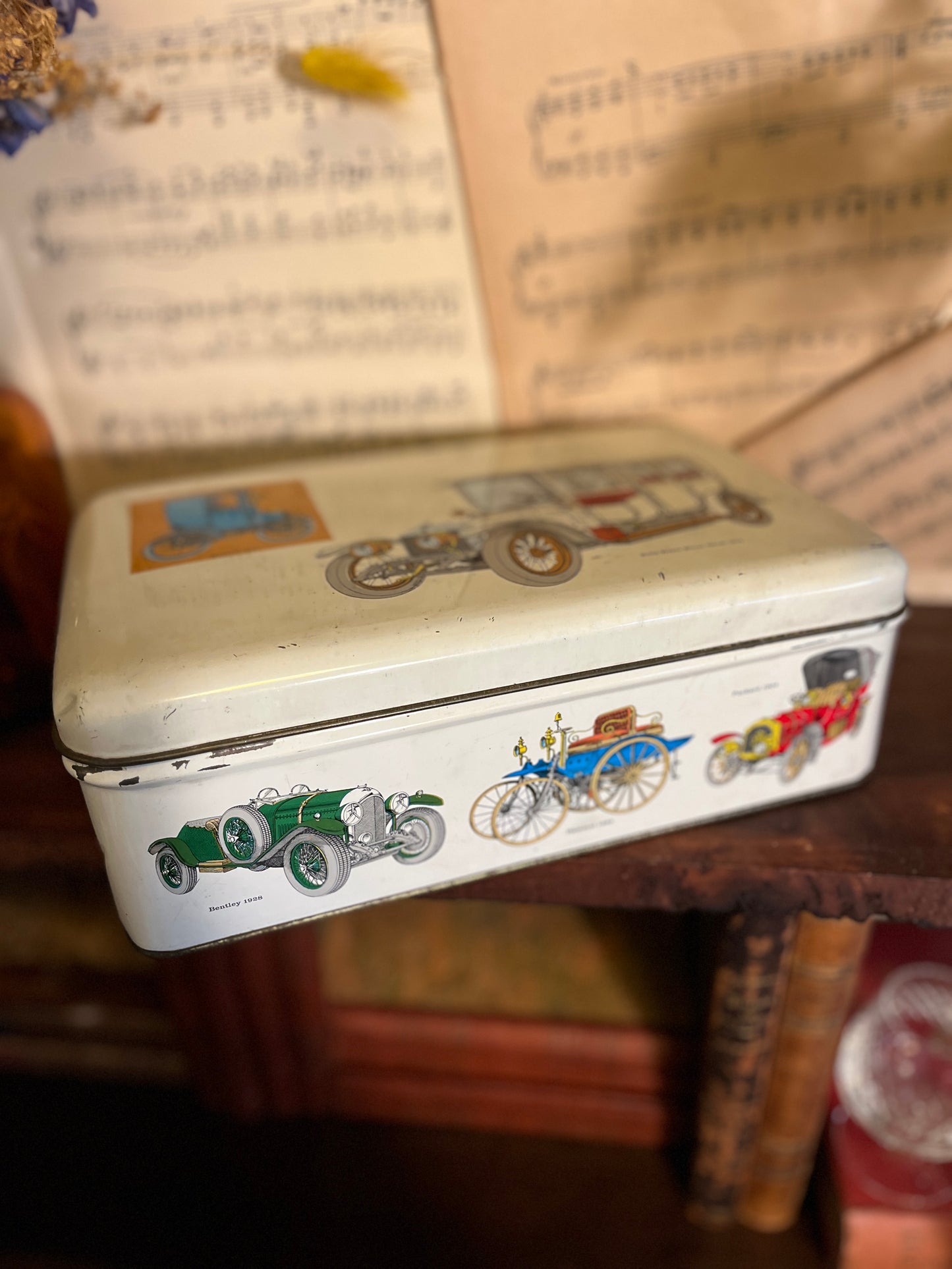 Tin with antique vehicles