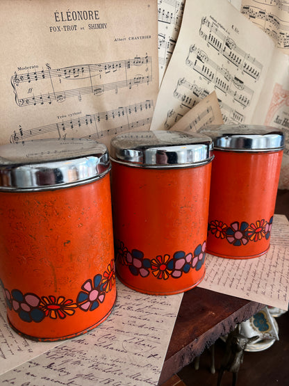 Set of vintage orange tins