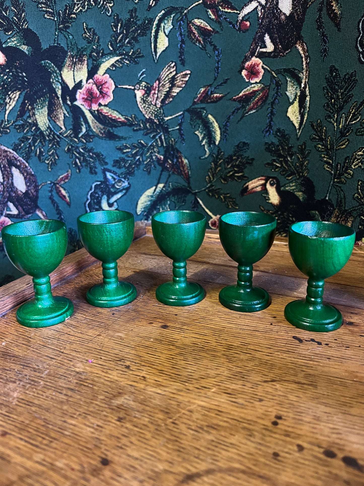 Set of green wooden egg cups