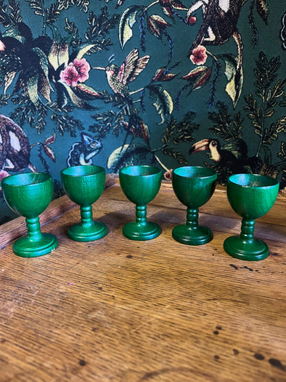 Set of green wooden egg cups