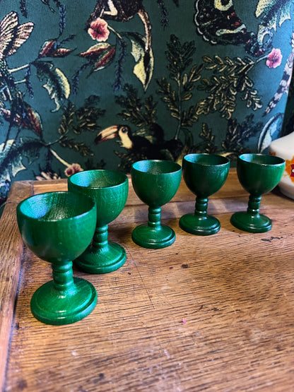 Set of green wooden egg cups