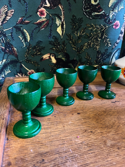 Set of green wooden egg cups